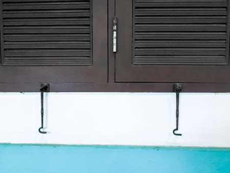 close up window, Decorative close up window on wall, Decorative brown window on an old white stucco...