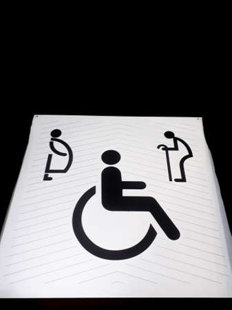 Disabled sign on grunge cement floor, wheelchair walkway symbol, wheelchair slope, friendly design architecture for all people, Symbol walkway for people with disabilities, white disabled sign on working streetの写真素材