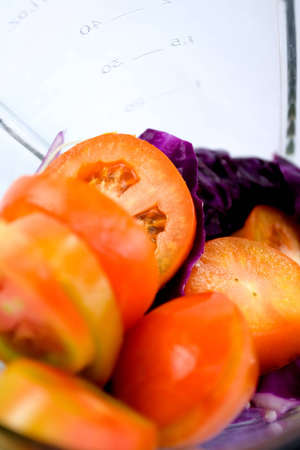 vegetables being prepared in the blender to make a vegetables juiceの写真素材
