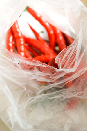 stock of red chili pepper as seasoning ingredients in a plastic bagの写真素材