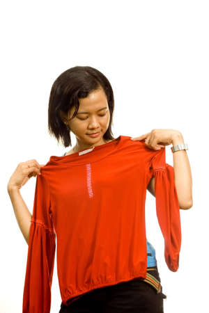 Asian young woman fitting clothesの写真素材