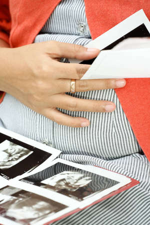 pregnant woman and ultrasound scan examination result