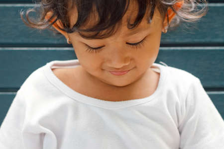 closeup portrait of adorable asian ethnic girlの写真素材