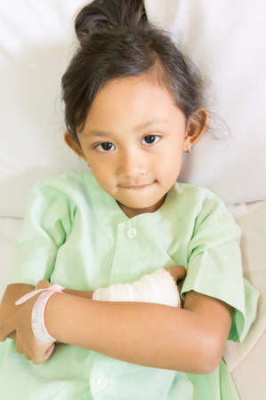 Portrait of Confident  Asian Ethnic Little Child Impatient in Hospital Smiling