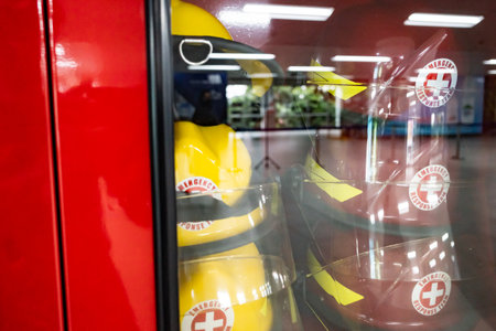 Safety equipment cabinet filled with helmets in public area building