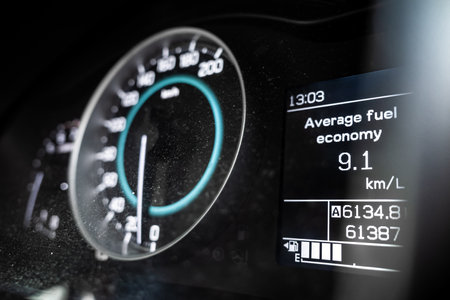 Average fuel consumption of a car displayed on car dashboardの写真素材