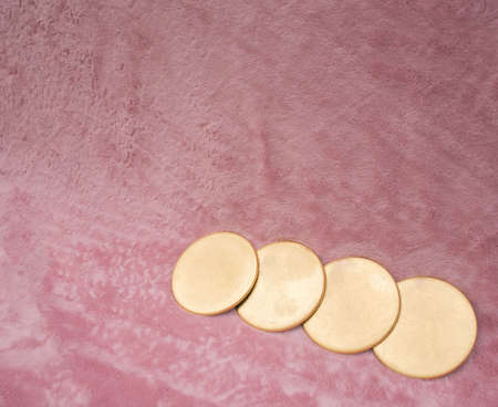 Golden rings on pink fluffy background. Minimalistic conceptの写真素材