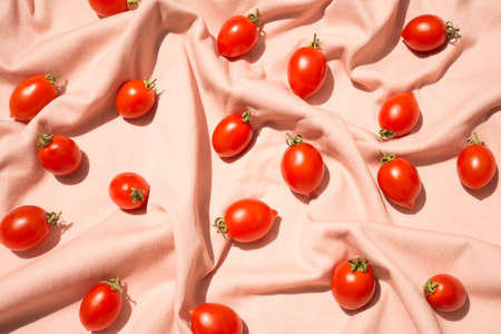Cherry tomato pattern on pink backgroundの写真素材