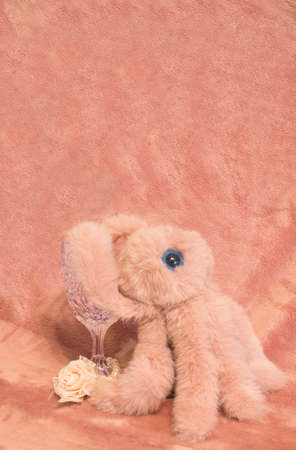 Let the celebration begin. The octopus celebrates with a glass of wine and a pearl bracelet. Minimalist conceptの写真素材