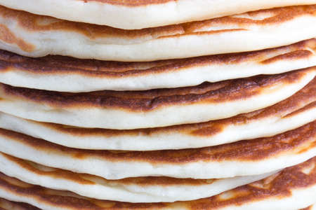 Stack of appetite homemade plain pancakes close-upの写真素材