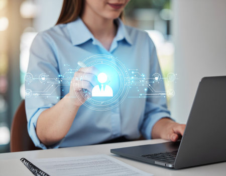 business, people and technology concept - close up of businesswoman working with laptop computer at officeの素材