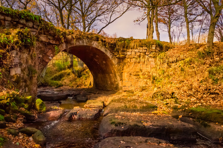 Autumn landscape magic bridge in Aguilar de Campooの写真素材