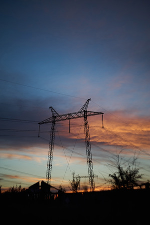 silhouette of high voltage electrical pole structure. power cables on big power tower.の写真素材