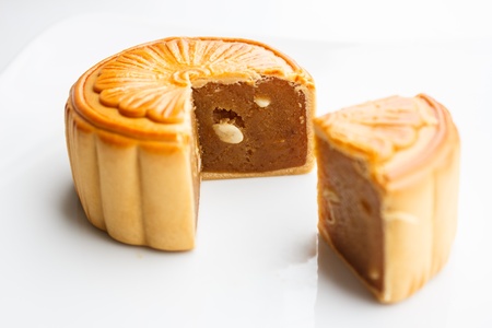 durian pulp with lotus seed  filled moon cake isolated on white backgroundの写真素材