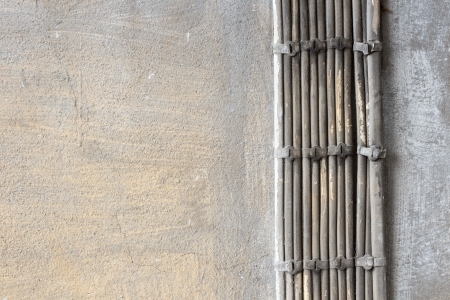 old wires on orange wall backgroundの写真素材