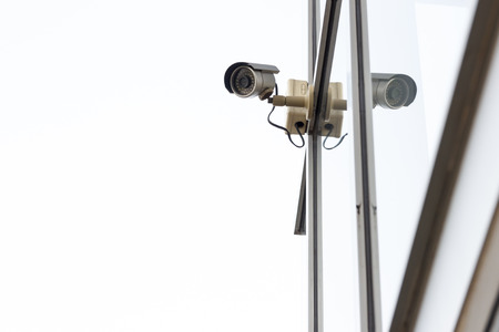 Silver CCTV camera on white backgroundの写真素材