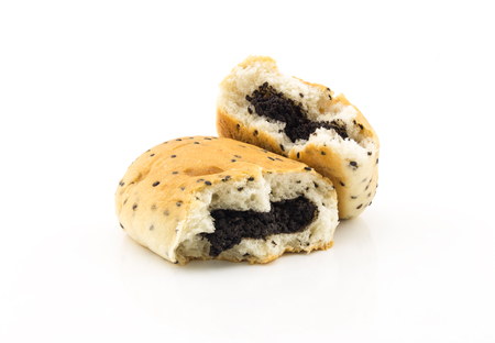 stacked of bun filled black sesame on white backgroundの写真素材