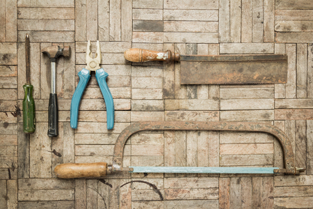 top view of a set of old carpenter tools on wooden parquet backgroundの写真素材