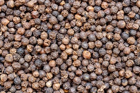 close up of black pepper seeds background