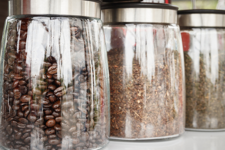 close up of coffee beans in glass jarの写真素材