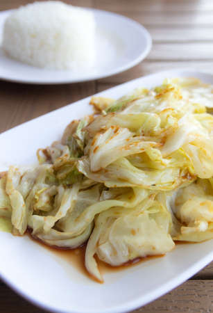 Stir fried Cabbage with fish sauce on plateの写真素材