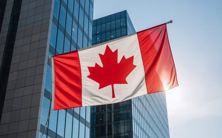 Canada flag on the background of skyscrapers in Toronto, Canadaの素材