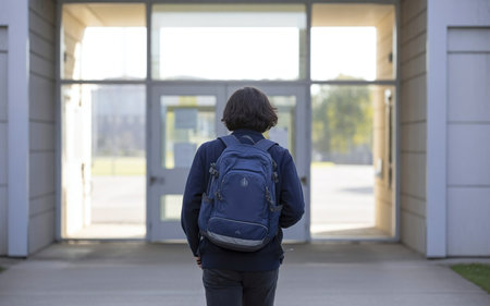 Back View of Middle School Student with Backpackの素材