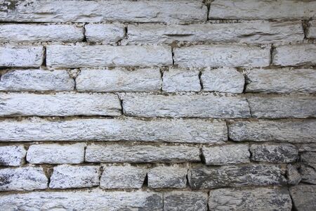 Grunge gray bricks texture wall and background, with beige and white color combinationの写真素材