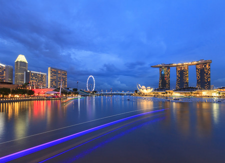 Singapore, Singapore - December 12, 2015 : Lighting of tourist boat and night view of Marina Bay, a famous tourist attractions in Singapore.のeditorial素材