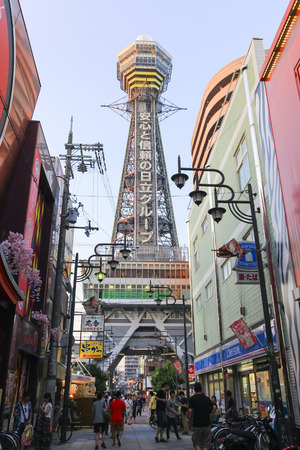OSAKA, JAPAN - AUGUST 1, 2015 : Tsutenkaku Tower is a famous landmark and symbol of Osaka city, Japan. This tower located in the Shinsekai (new world) district area which many restaurants, bars and shops around here.のeditorial素材