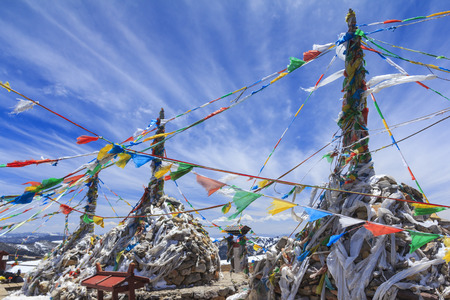 Prayer flags and stupa at the top of Blue Moon Valley (Shika Snow Mountain), Shangri-La, Yunnan, Chinaの写真素材