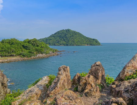 Beautiful aerial view point of tropical sea bay and island, with mountain cliff and rocks in foreground, Noen Nangphaya View Point at Chalerm Burapha Chonlathit Highway, Chanthaburi, Thailand.の写真素材