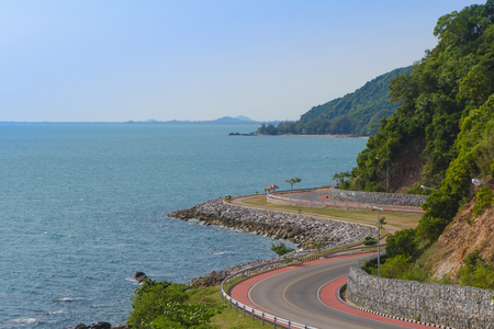 Coastal road along tropical sea bay view landscape, view from Noen Nangphaya View Point at Chalerm Burapha Chonlathit Highway, Chanthaburi, Thailand.の写真素材