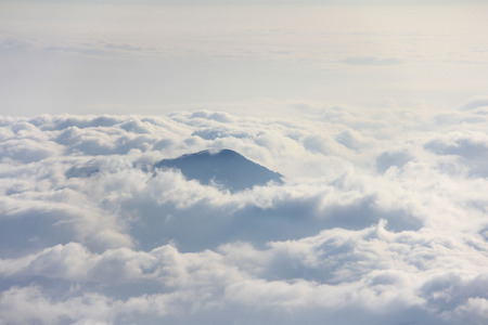 Mountain peak above sea of clouds, at Mountain Fuji (Fujisan) climbing trail, Japanの写真素材