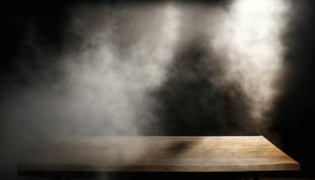 Empty wooden table with smoke on black background. For montage product displayの写真素材