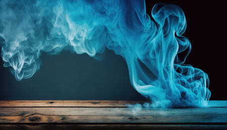 Blue smoke on wooden table and black background. Copy space for your text.の写真素材