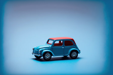 Miniature toy car on blue background. Minimalism style.の写真素材