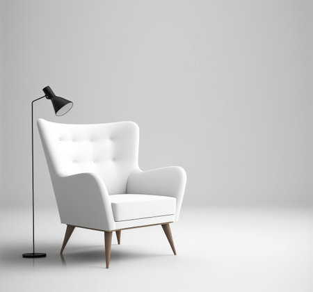 White armchair with a lamp on a gray background.の素材