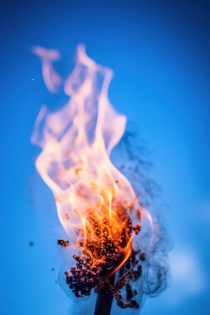 Burning plant on a blue background. Close-up. Macro. Shallow depth of field. generative aiの素材