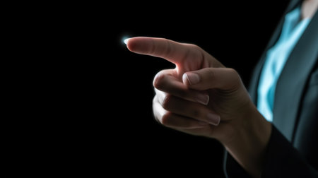 Businesswoman touching screen with finger on black background, close-up. AI Generativeの素材