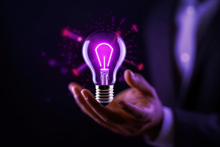 Businessman holding glowing light bulb in his hand. Idea and innovation concept. AI Generatedの素材