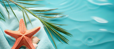 Summer background with starfish and palm leaf on turquoise waterの素材