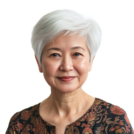Portrait of smiling senior asian woman with short white hair isolated on white background.の素材
