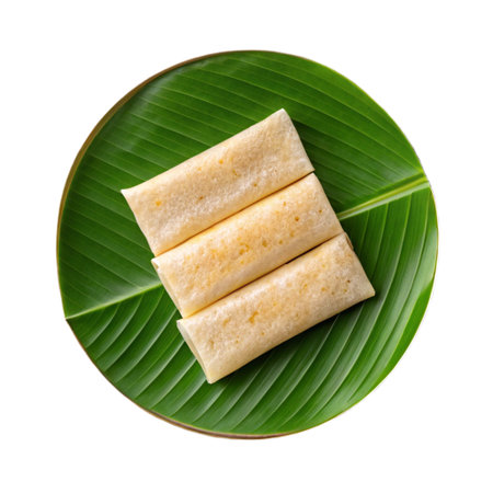 Thai sweetmeat on green banana leaf isolated on white background.の素材