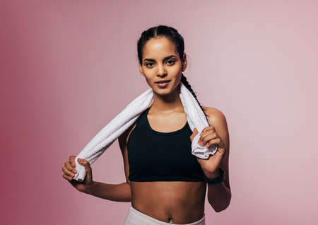 Portrait of a young sportswoman posing in studioの写真素材