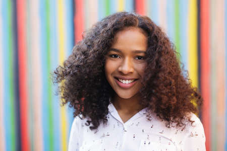 Portrait of a beautiful woman with curly hairの写真素材
