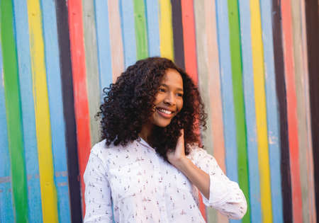 Portrait of a beautiful woman with curly hairの写真素材