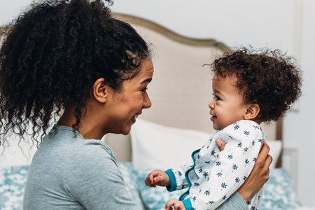 Young happy mother and her son looking to each otherの写真素材