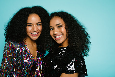 Close up portrait of a two brunette woman in stylish clothes looking at a cameraの写真素材