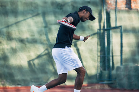 Tennis player doing intense training outdoors